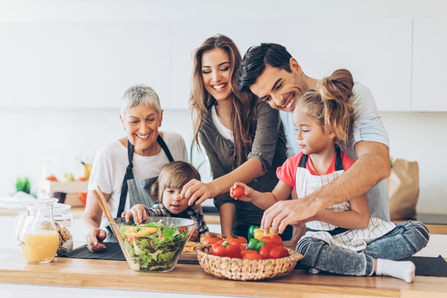 family cooking in kitchen