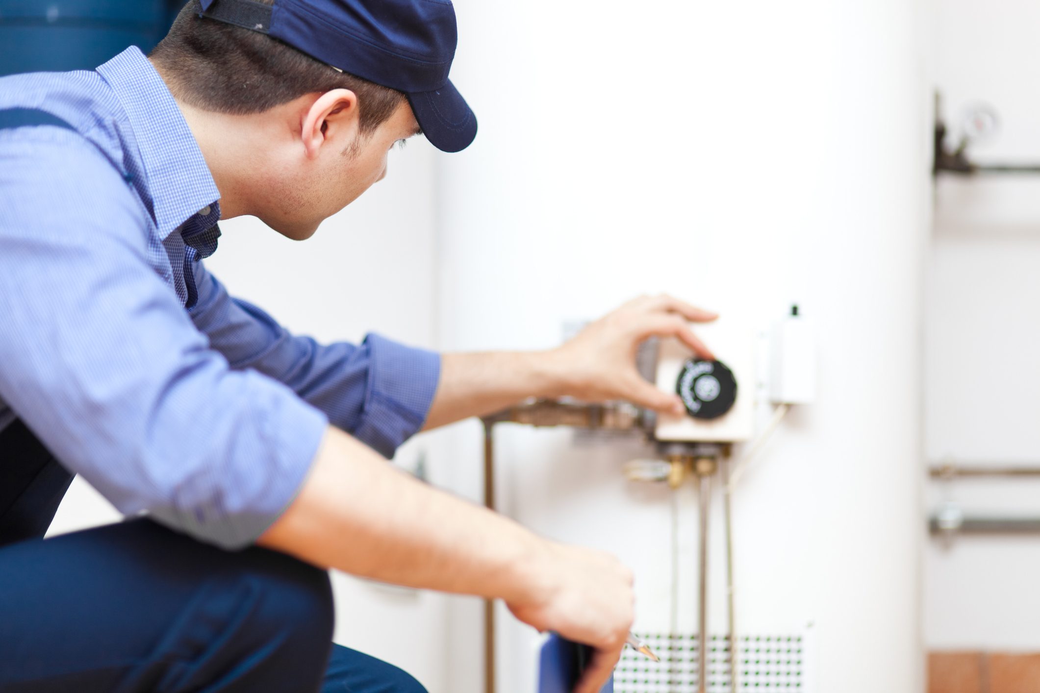 man installing water heater