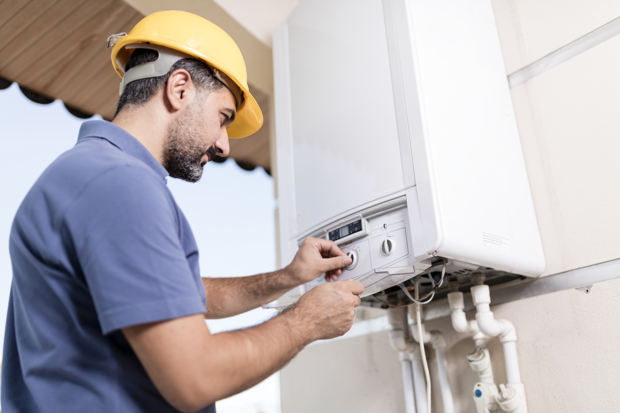 man working on HVAC unit